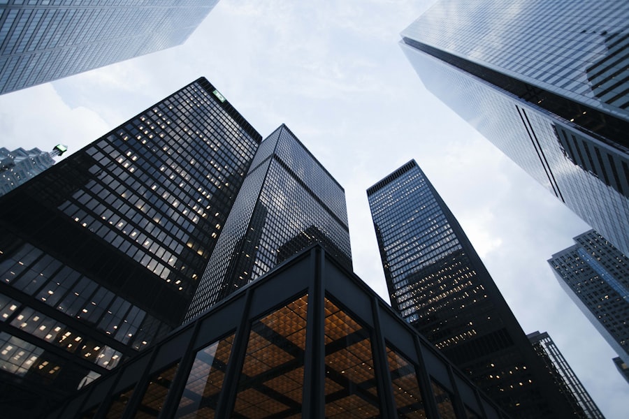 Modern glass office building reflecting the sky